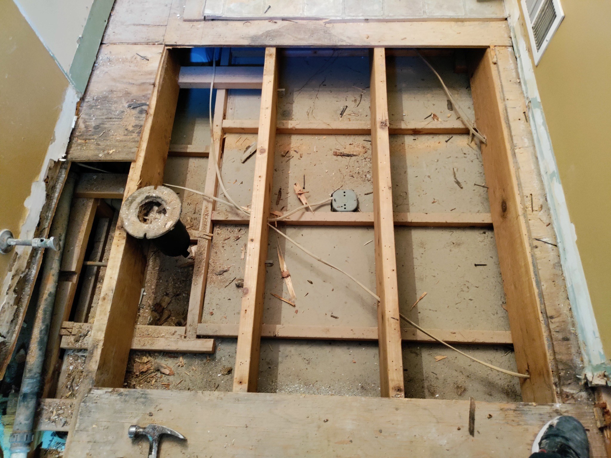 Bathroom floor removed down to joists during hidden water damage repair in Utah