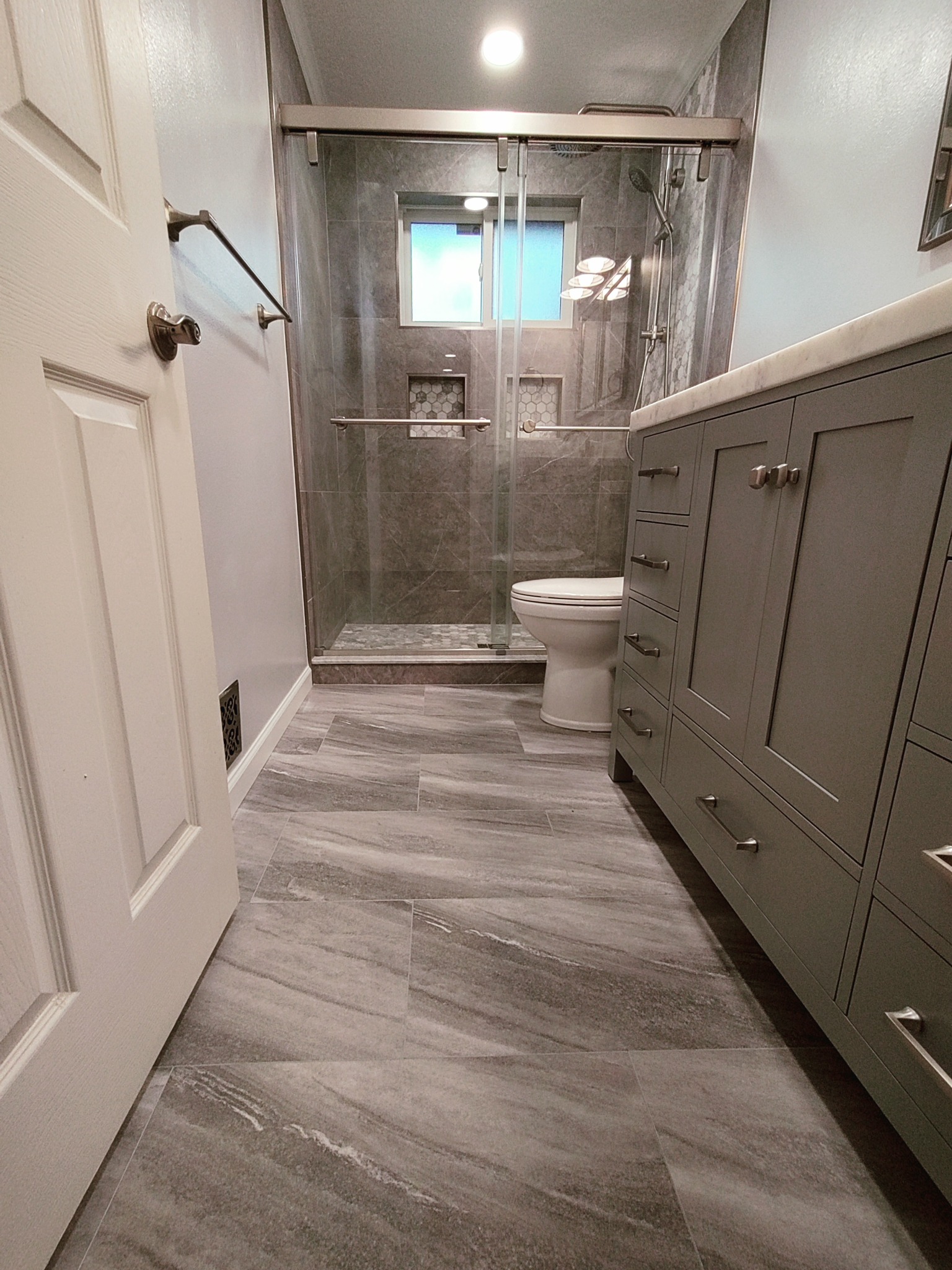 Finished custom tile shower after hidden bathroom damage repair in Utah