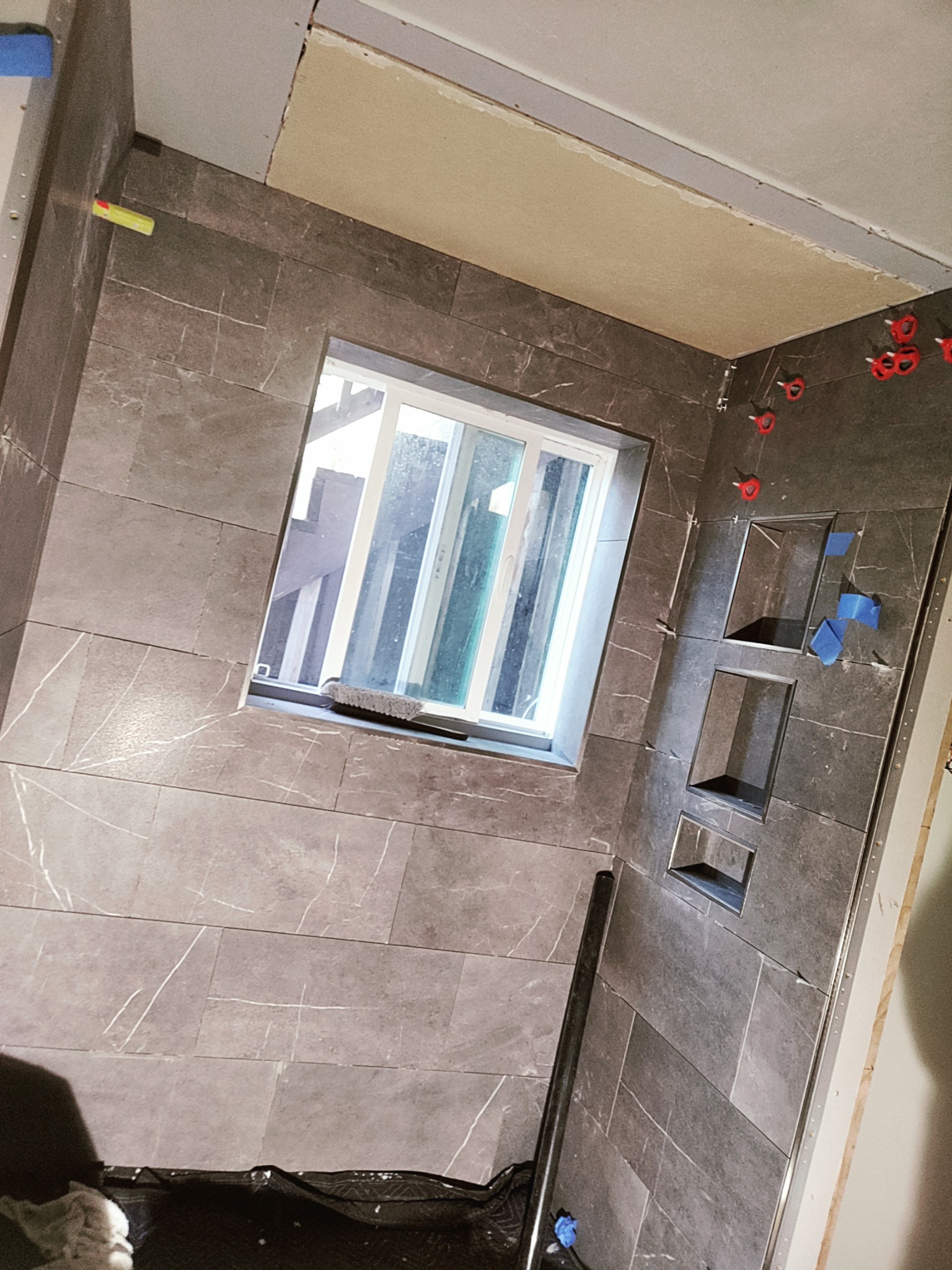 Custom tile shower installation in progress during Utah tub to shower conversion