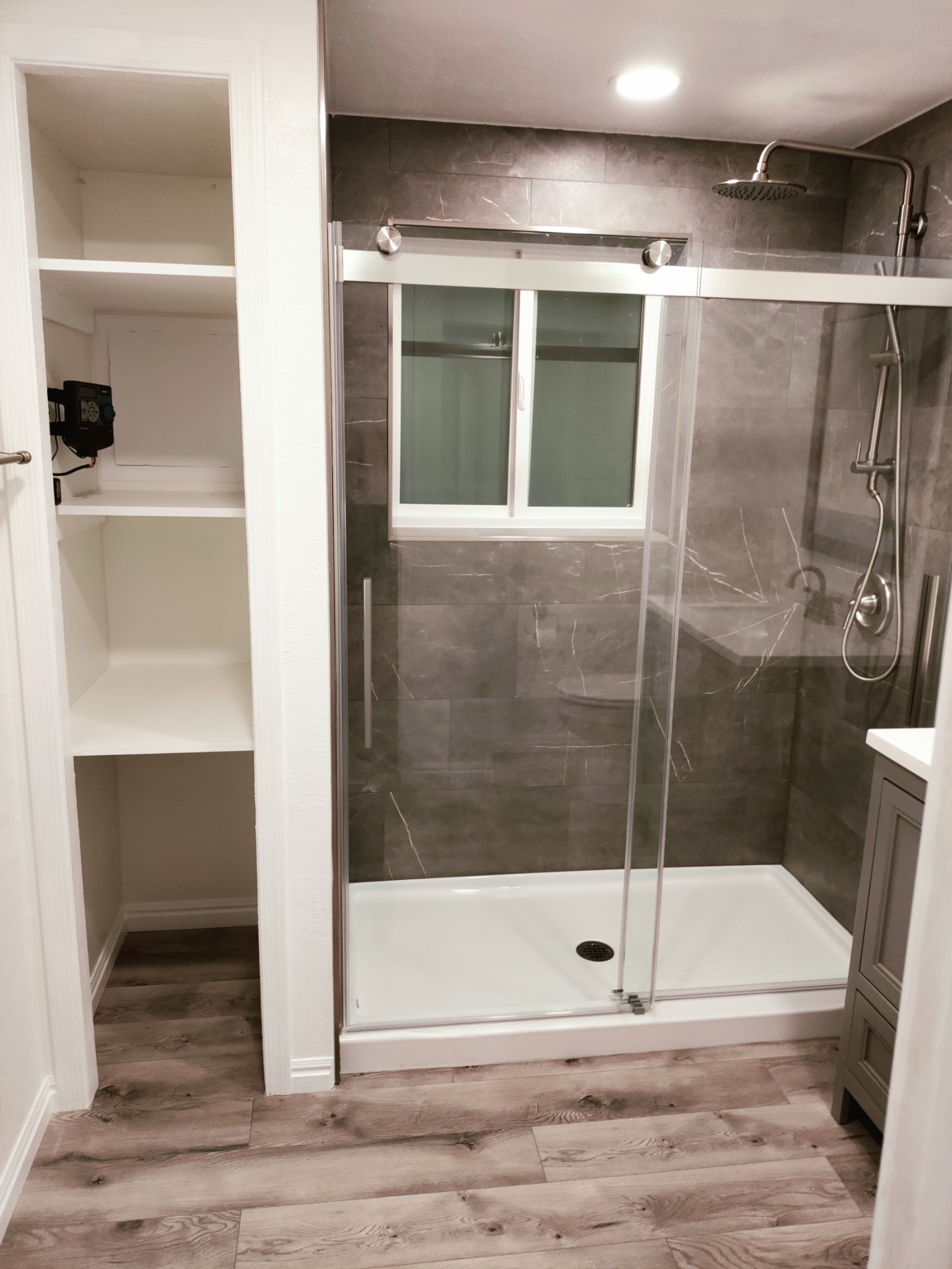 Finished walk in shower with glass enclosure after tub to shower conversion Utah