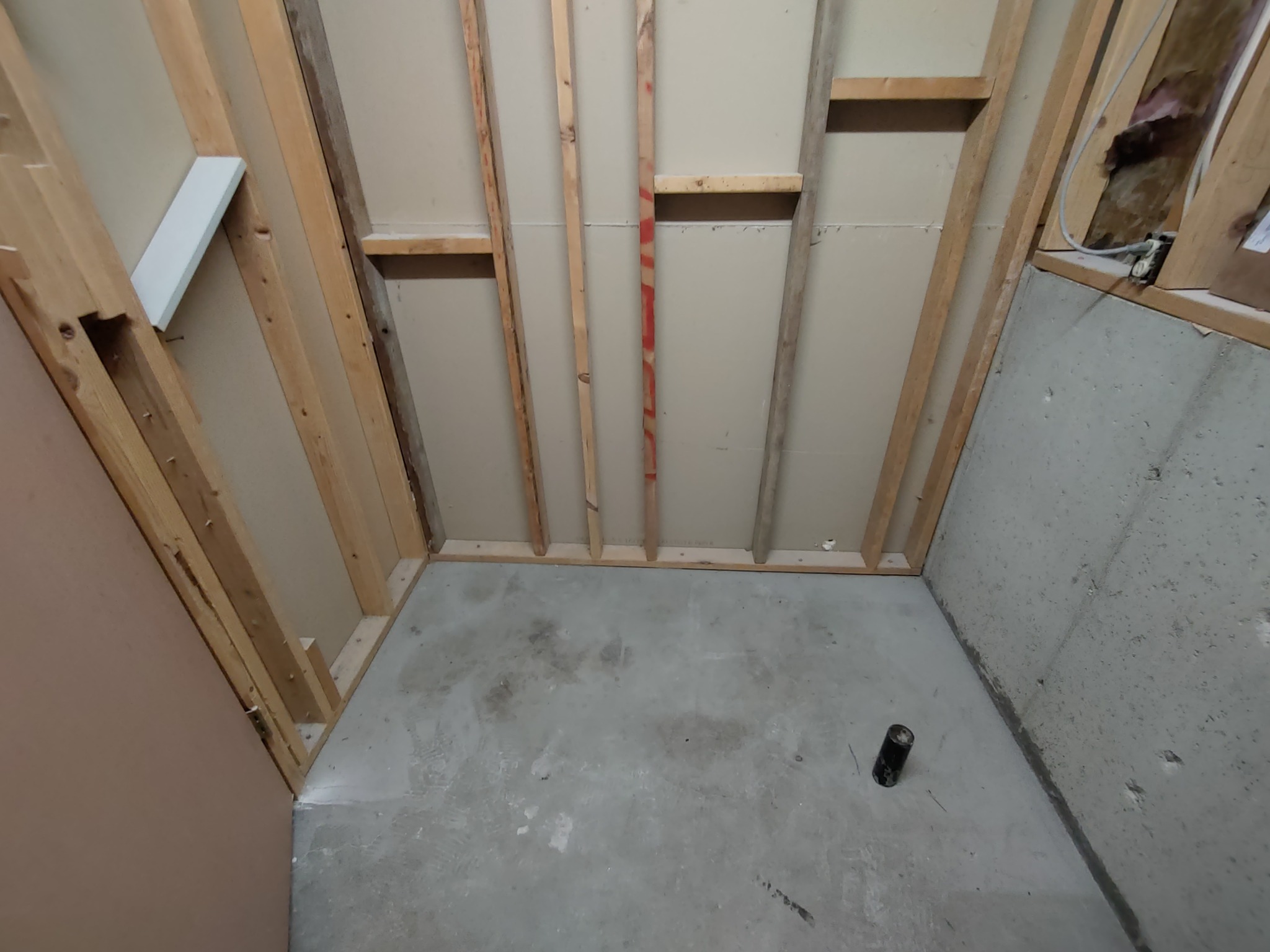 Old shower and tub area before low maintenance shower system remodel in Utah