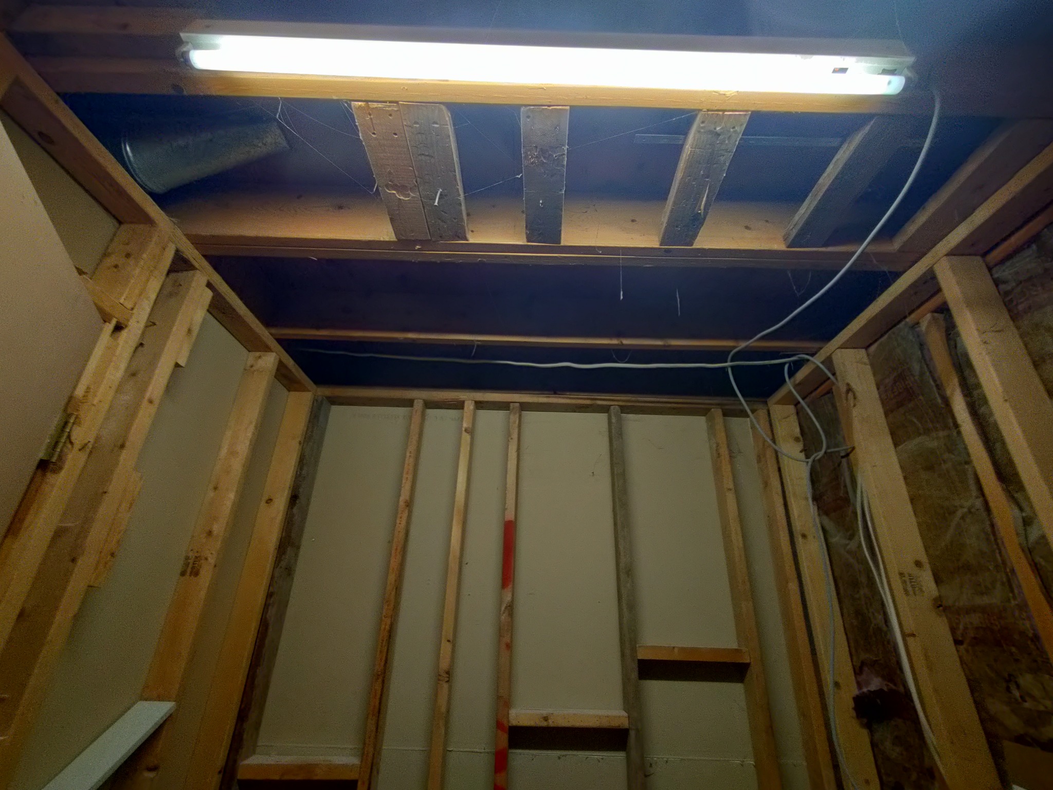 Shower demo with open framing during low maintenance shower remodel in Utah