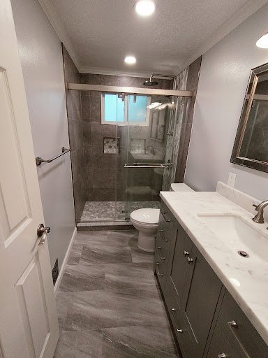 Bathroom remodel with modern vanity and glass shower