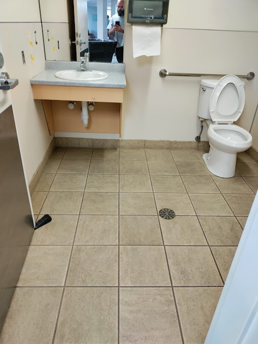 Sandy commercial restroom before remodel